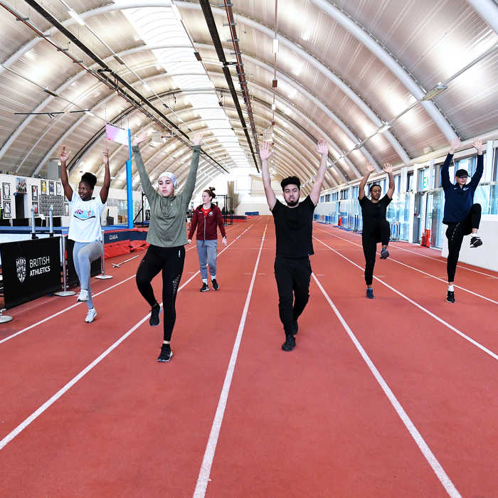 Sports students exercising in the indoor athletics centre