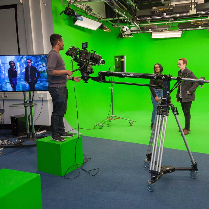 Digital media students filming in the green room
