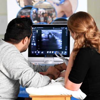 Musculoskeletal Ultrasound students looking at screen