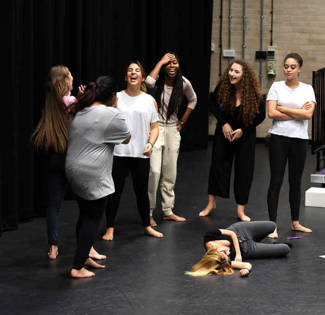 Theatre students practicing on the stage of Brunel University London
